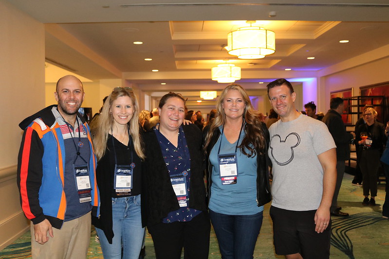 Five OLC Volunteers smile together for a photo at OLC Accelerate 2025